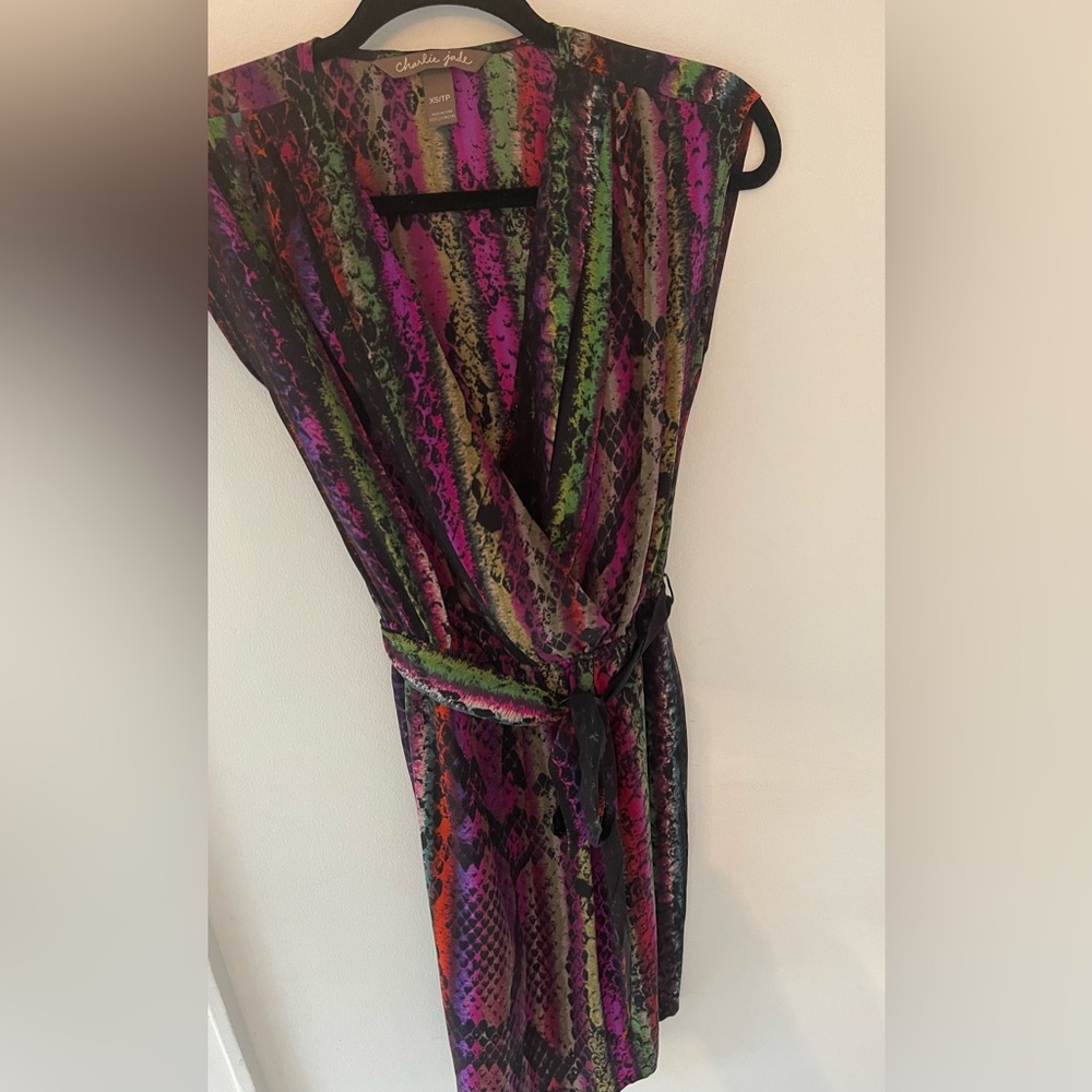 Purchased from a boutique in Toronto. Above the knee 100% silk dress.